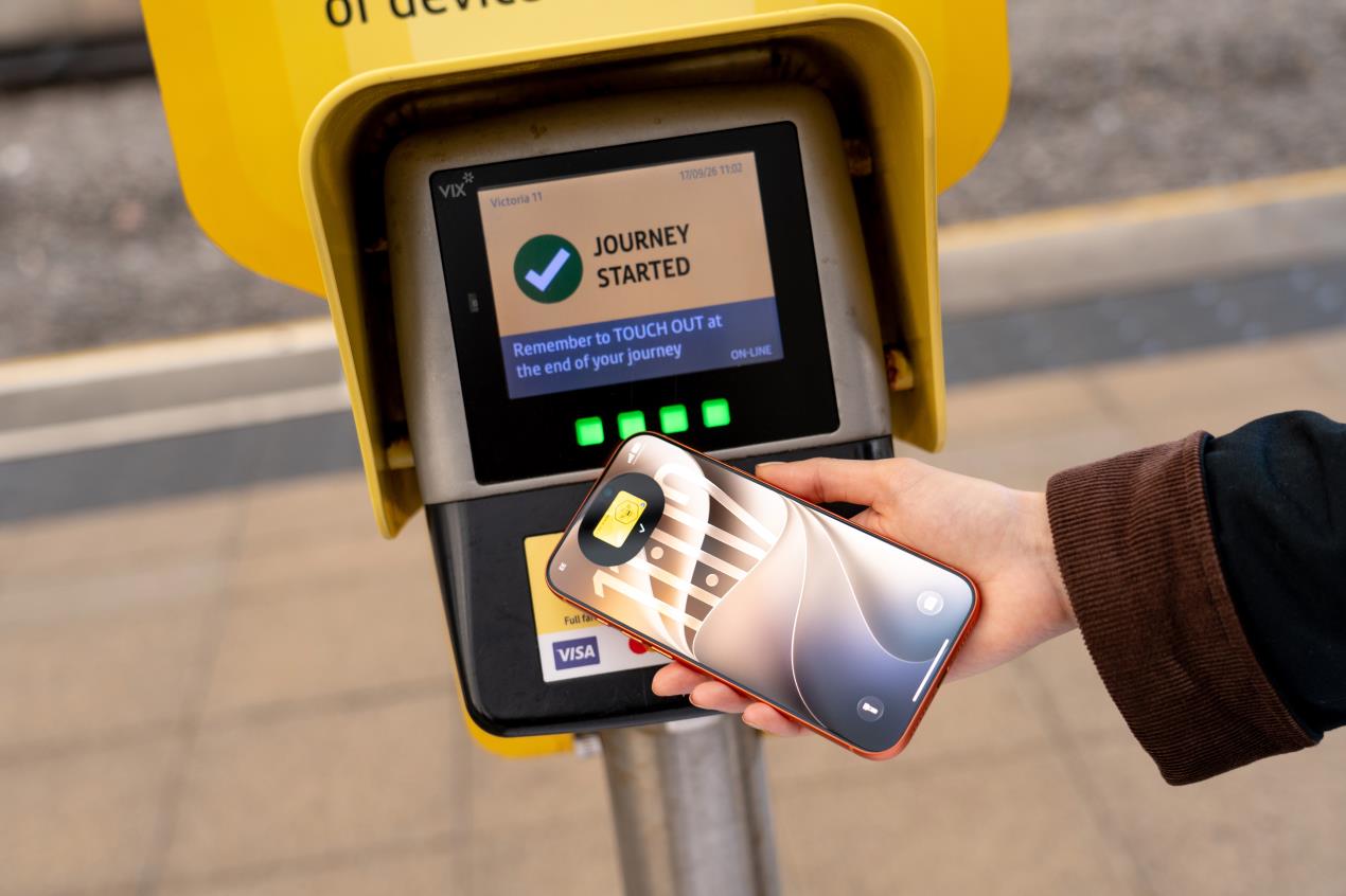A person scanning their bee card on iPhone